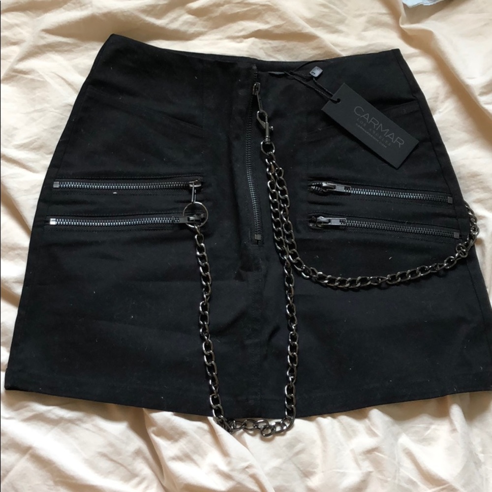 Car at black skirt with chains. Never been worn
